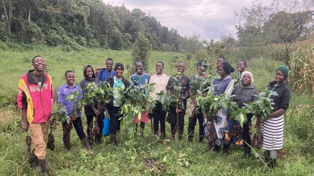 KCWCG planting team showing previously KCWCG reforested section on the left and new planting area in the agricultural encroachment on the right